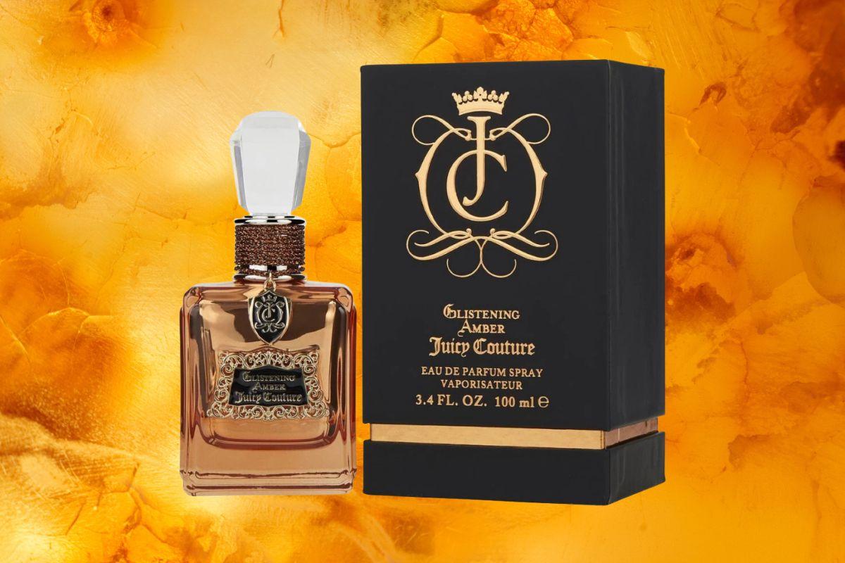 Juicy Couture Glistening Amber perfume bottle and box displayed against a warm amber background.