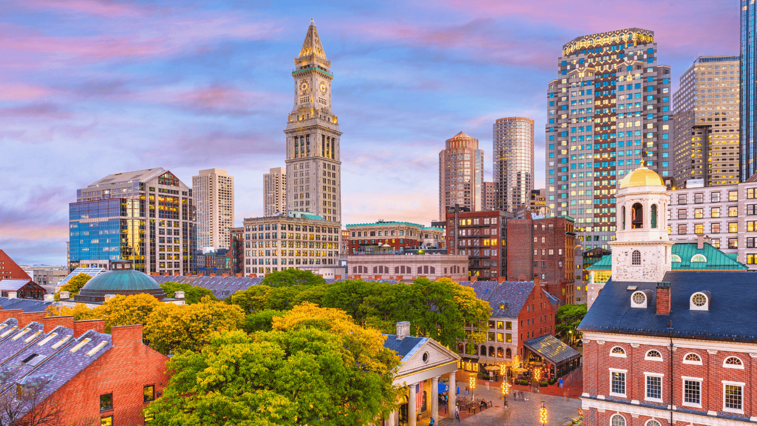 Stunning sunset view of downtown Boston, blending historic architecture with modern skyscrapers, highlighting the city's vibrant atmosphere. Ideal for budget-conscious travelers looking for cheap hotels in Boston, this image captures the essence of the city's charm and its proximity to affordable accommodation options near popular landmarks and attractions.