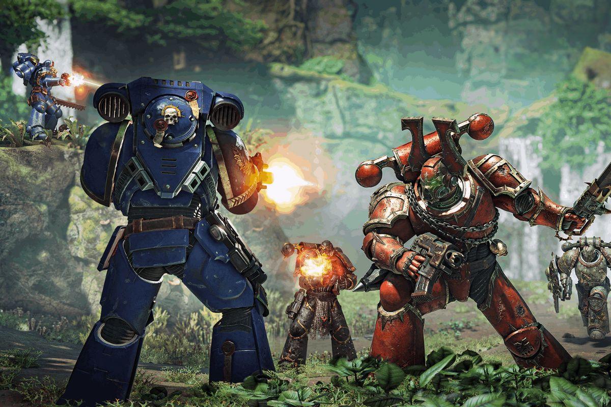 Armored soldiers in blue and red power suits engage in an intense battle in a lush, forested environment.