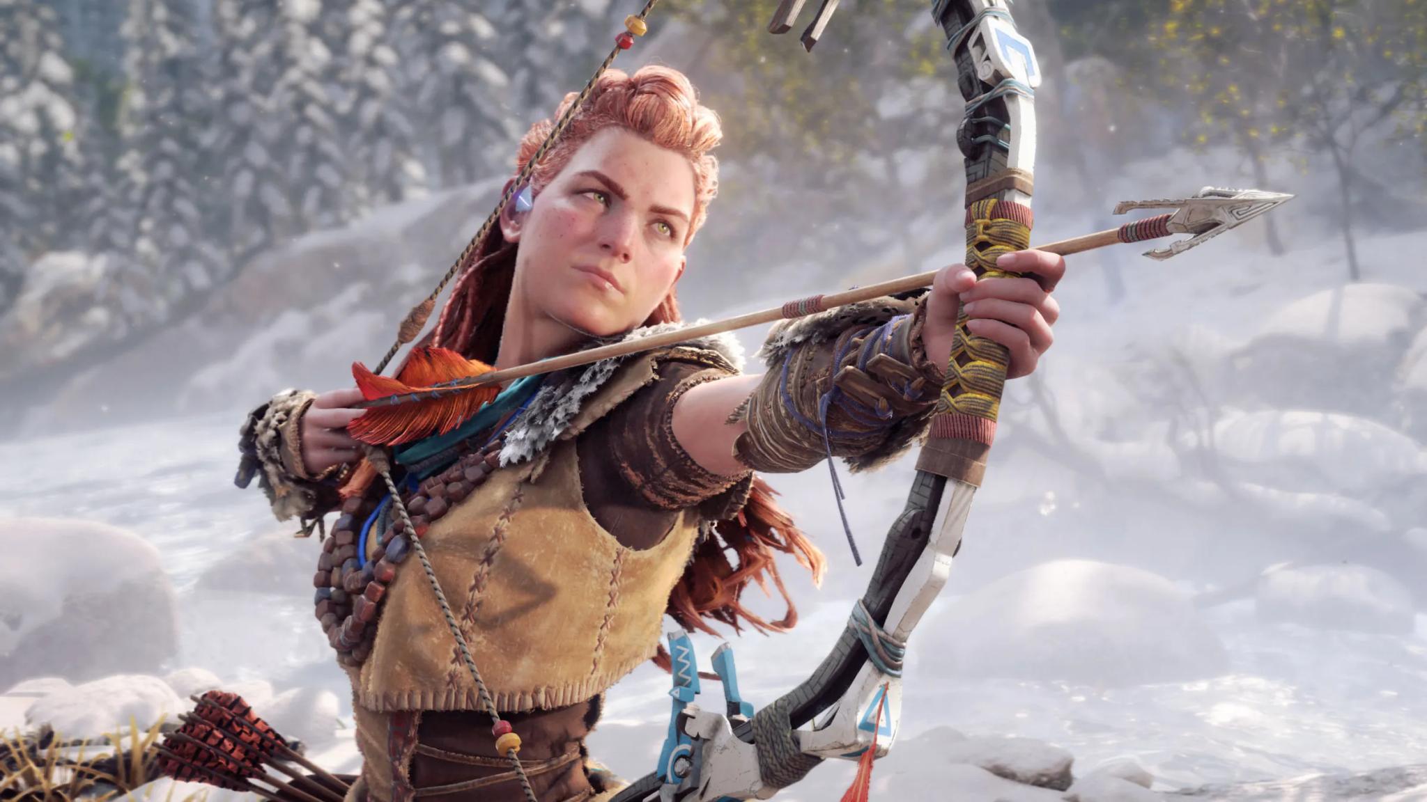 A female warrior with red hair aiming a bow and arrow in a snowy forest, wearing detailed tribal-inspired armor.