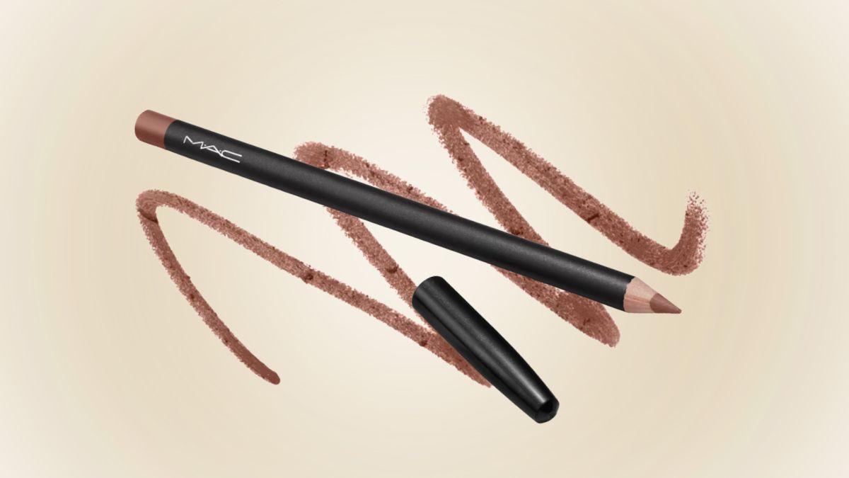 A MAC lip liner pencil with its cap removed is displayed on a soft beige background, with brown-beige swirls showing its creamy texture and shade.