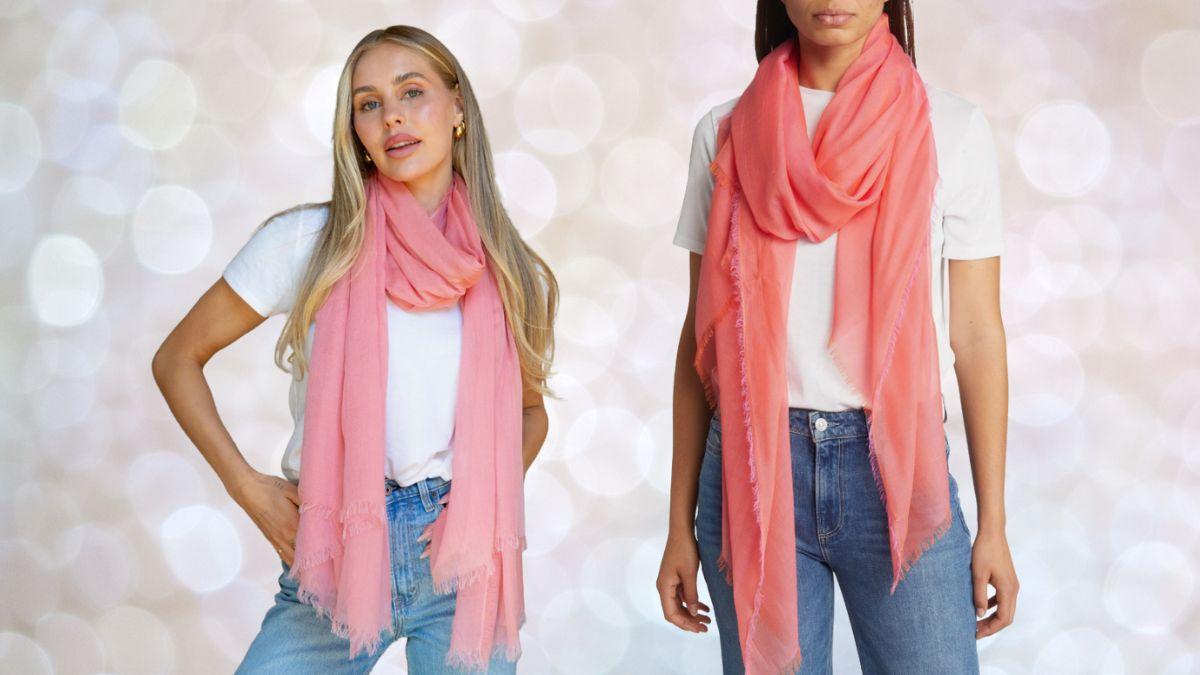 Two models wearing a pink modal and silk scarf in different styling options over casual outfits.