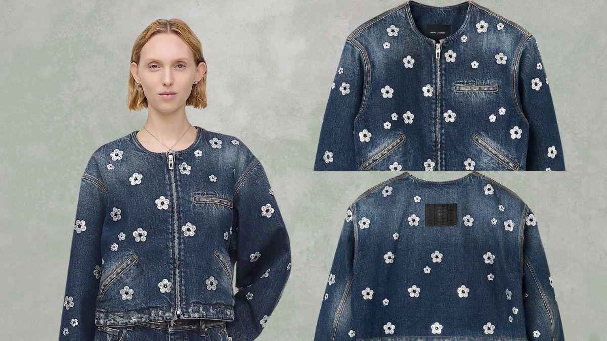 A denim cropped jacket with white sequin daisy flowers, a front zipper, and pockets, shown on a model and in close-up views.