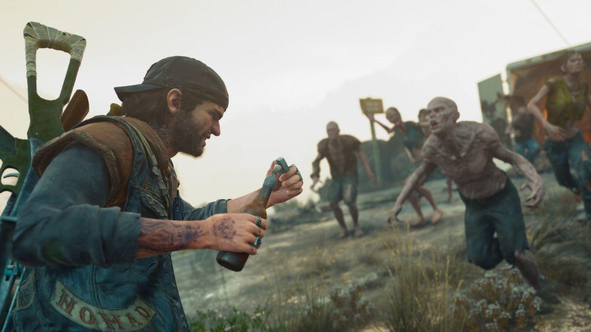 A survivor prepares to throw a Molotov cocktail as a horde of infected creatures rushes toward him in Days Gone.