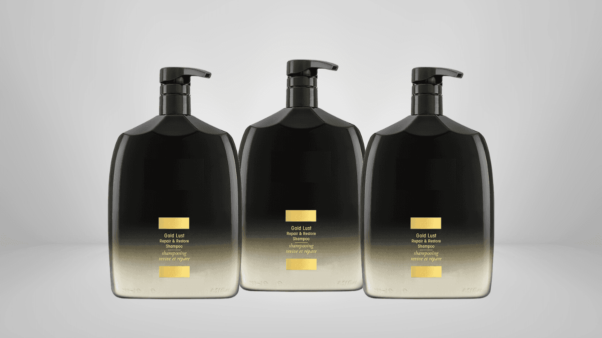 Three sleek black and gold hand soap dispensers with pump tops, elegantly displayed against a neutral background for a clean, modern look.