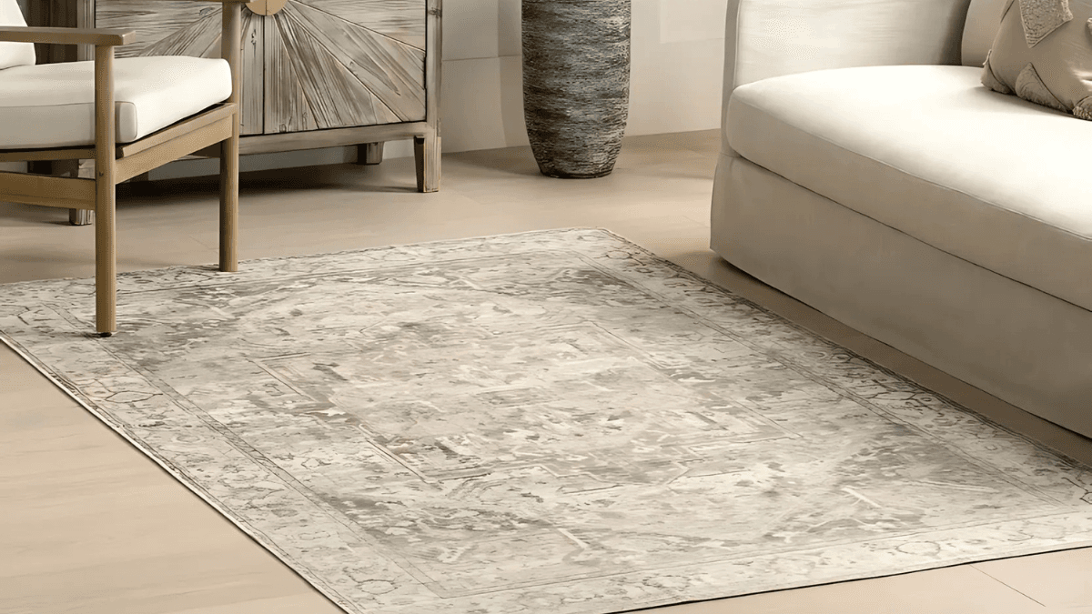 Neutral-toned area rug with subtle vintage-inspired patterns, perfect for minimalist and elegant interiors.