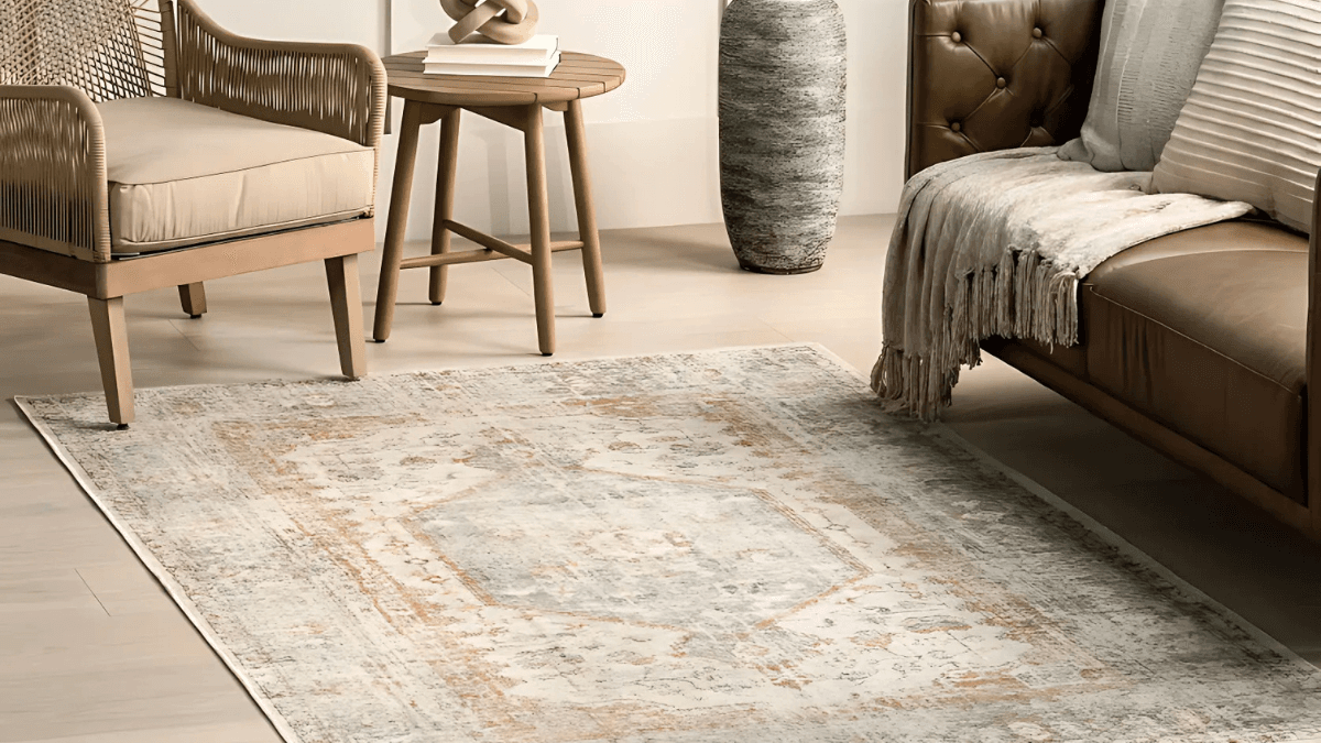 Elegant vintage-inspired area rug featuring soft beige and rust tones with intricate patterns, ideal for cozy living spaces.