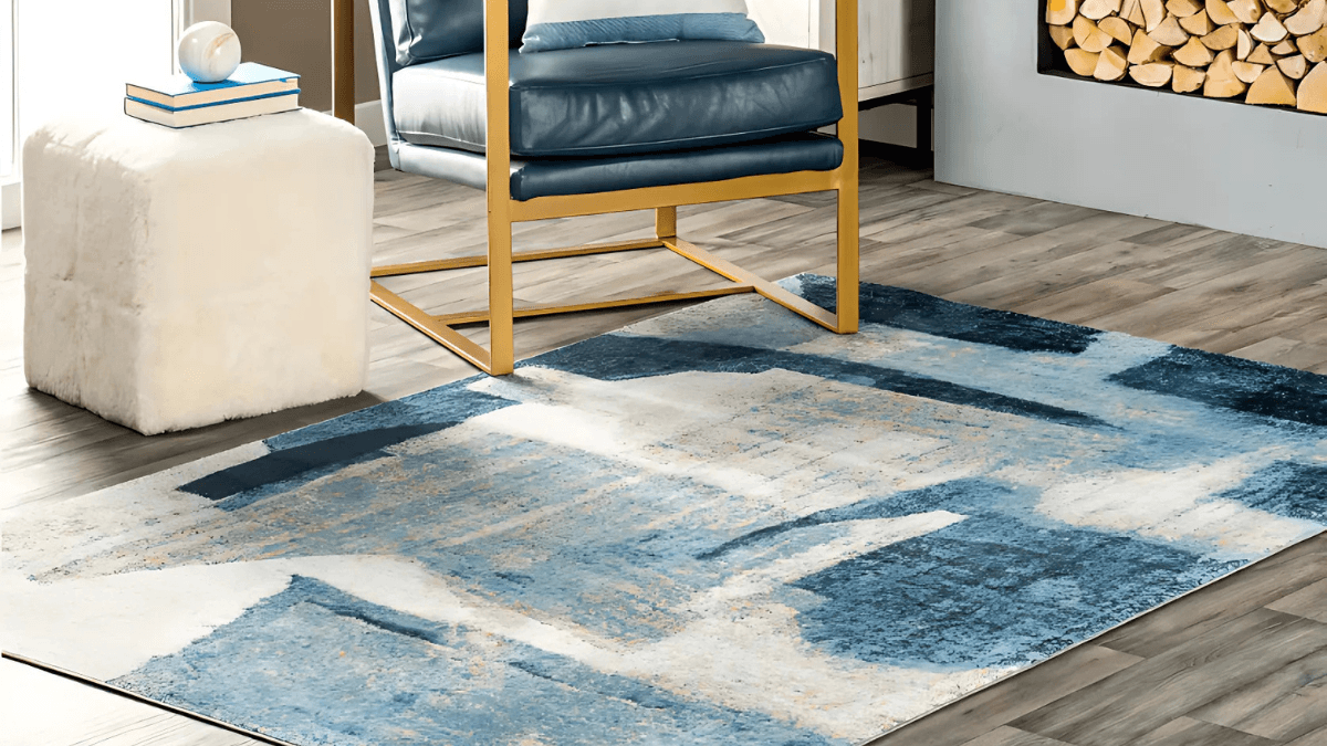 Contemporary area rug featuring abstract blue and white patterns, adding a modern touch to any living space.