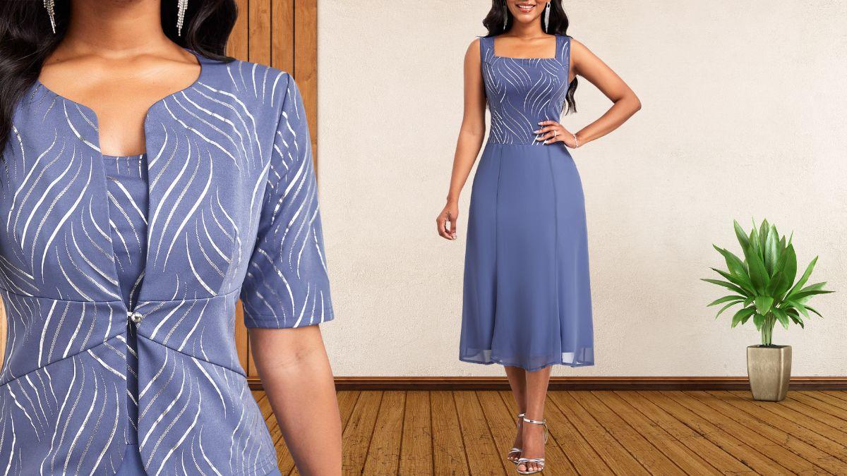 A woman wearing a dusty blue dress with a moire print, shiny hot stamping details, a matching cardigan, and silver heels.