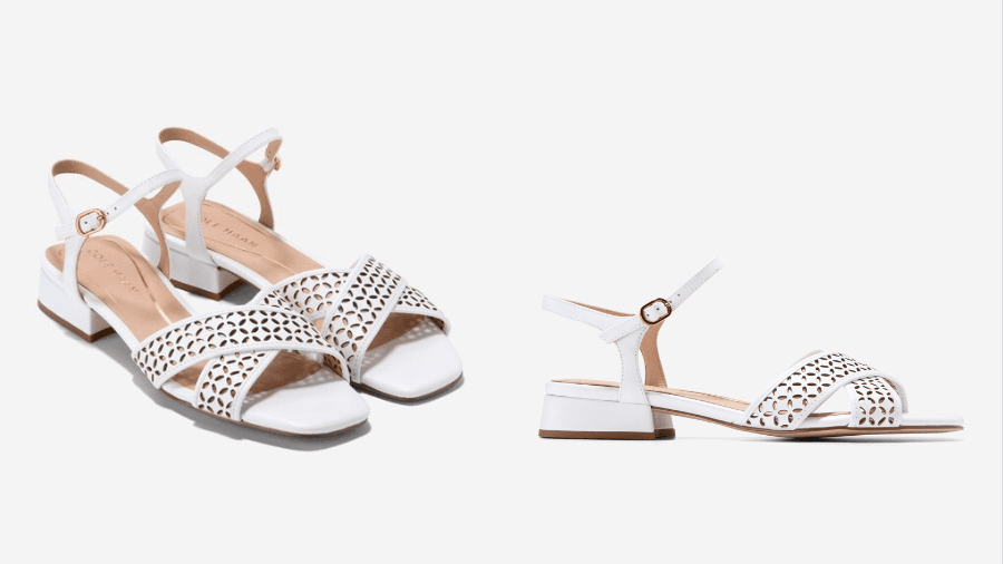 A pair of white leather sandals with a cutout design, block heel, and adjustable ankle strap, displayed from two angles against a white background.