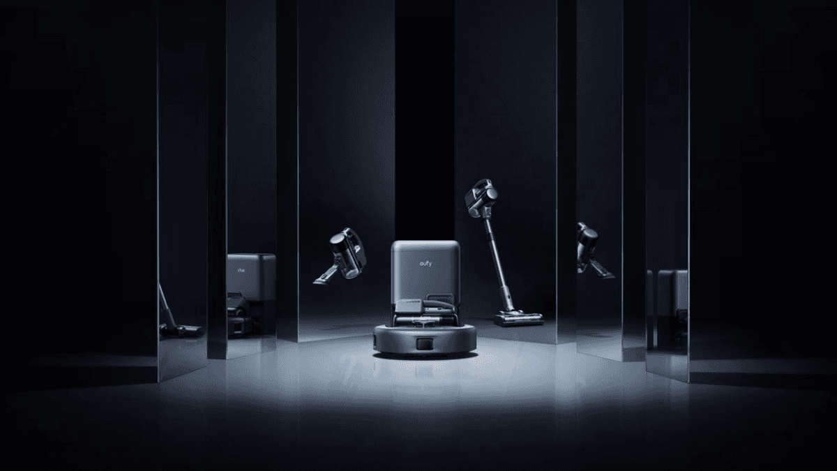 Futuristic display of a smart robot vacuum and cordless stick vacuum in a dark, reflective setting.