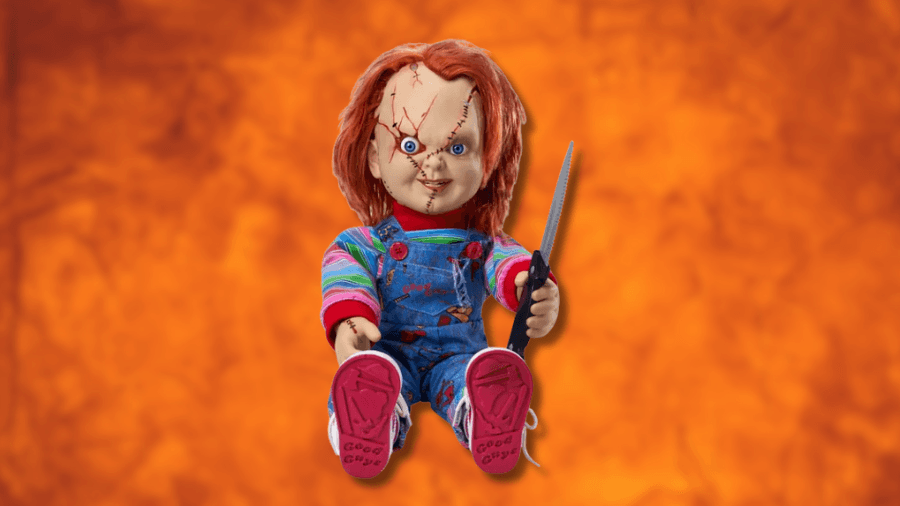 Chucky doll from the Child's Play horror series, wearing colorful striped sleeves, blue overalls, and red shoes, holding a knife with an orange textured background.