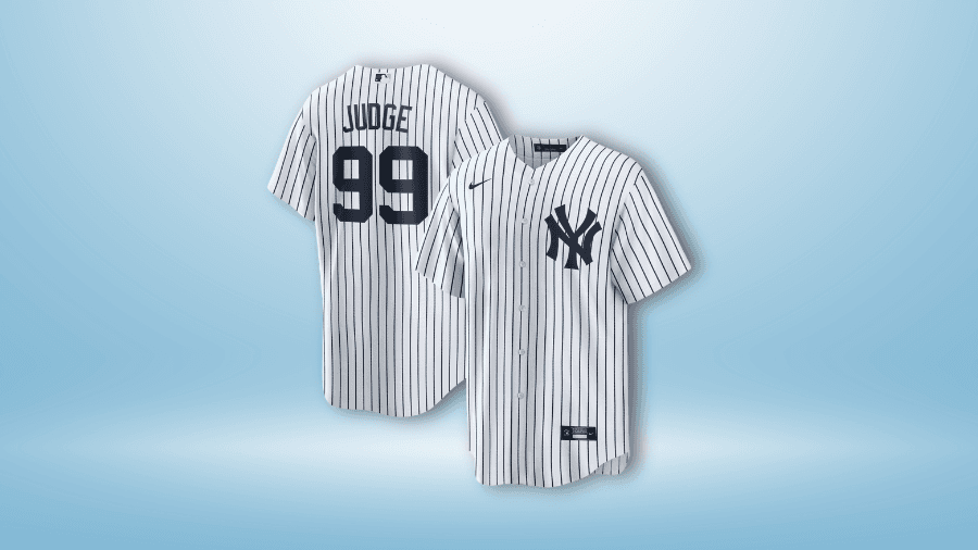 New York Yankees pinstriped jersey featuring "Judge 99" on the back and the Yankees logo on the front, displayed against a light blue background.