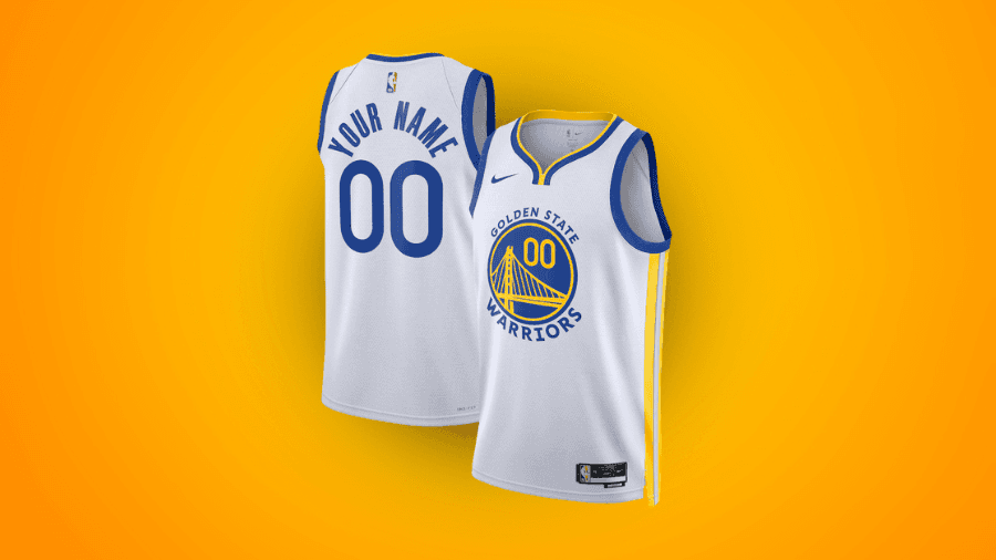 Customizable Golden State Warriors jersey in white with blue and yellow accents, featuring "Your Name" and number "00" on the back, displayed against an orange background.