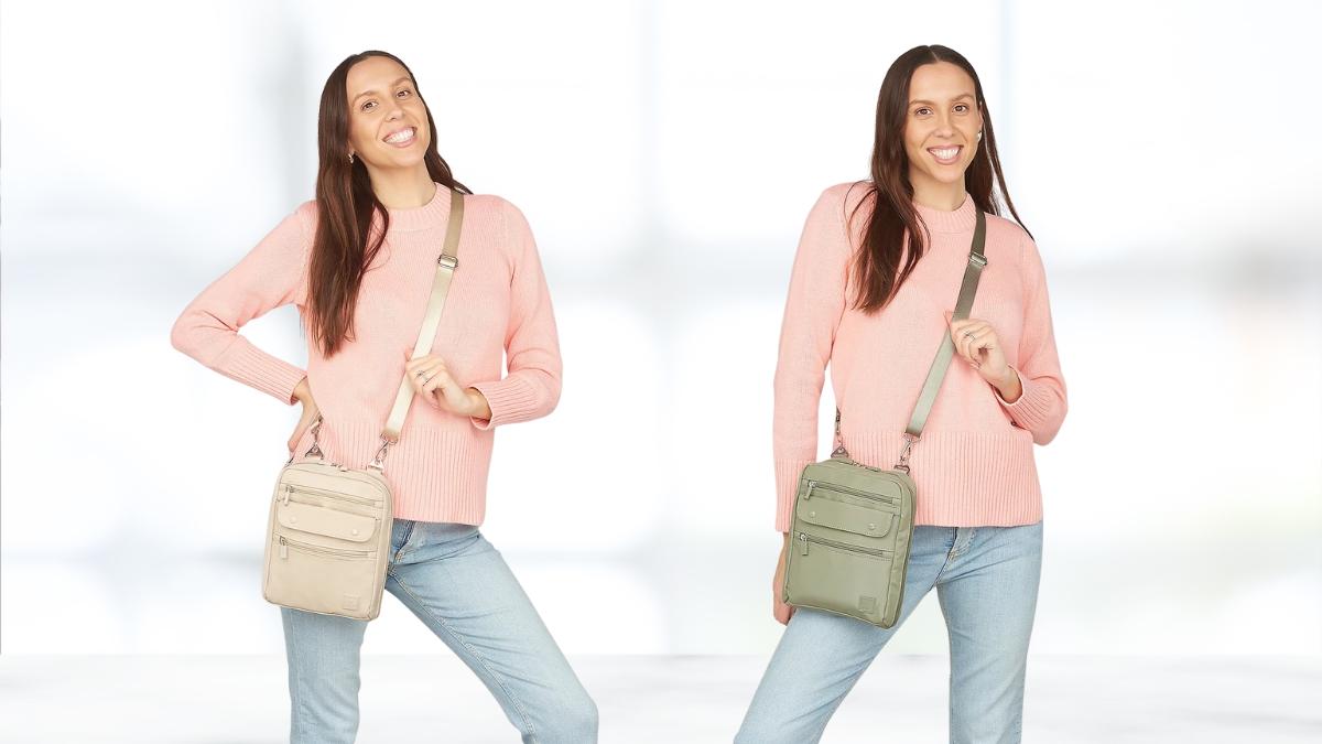 Woman wearing a pink sweater and jeans models the IHKWIP Companion North/South Crossbody Bag in beige and green.