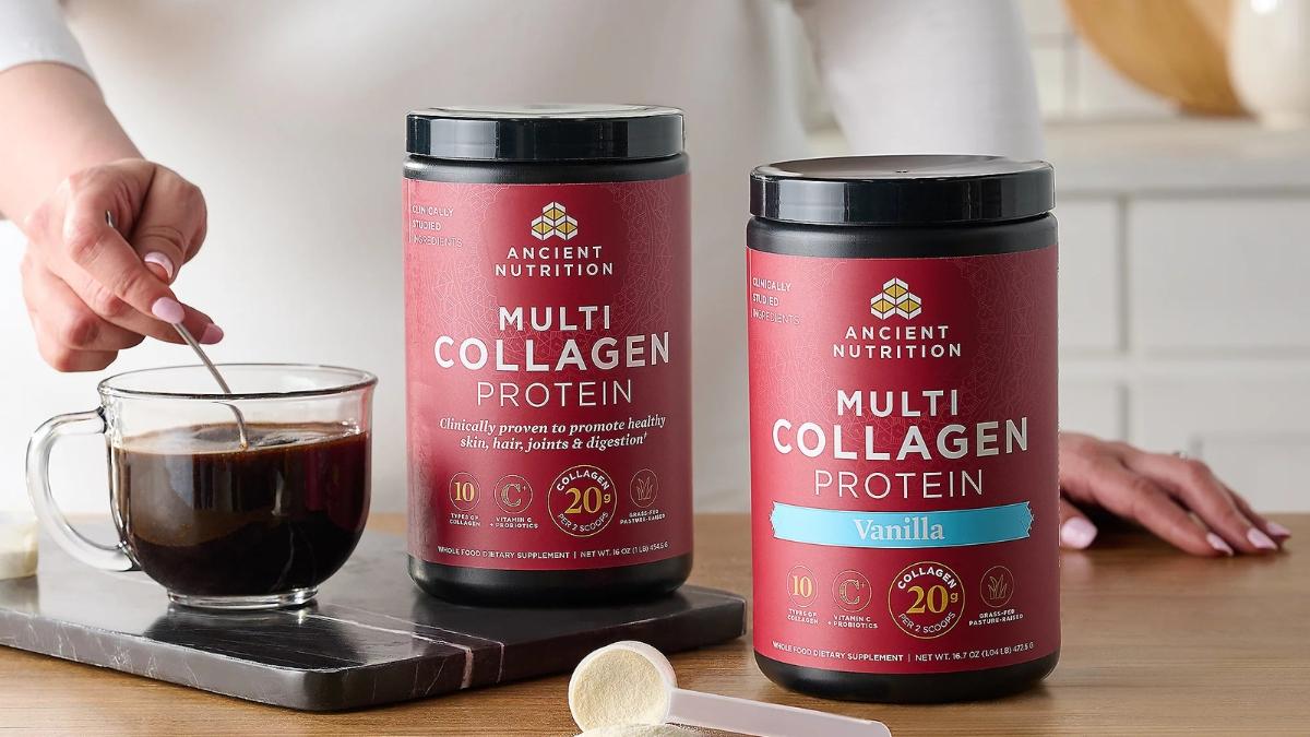 Two tubs of Ancient Nutrition Multi Collagen Protein, one original and one vanilla, shown next to a cup of coffee with a scoop being stirred in.