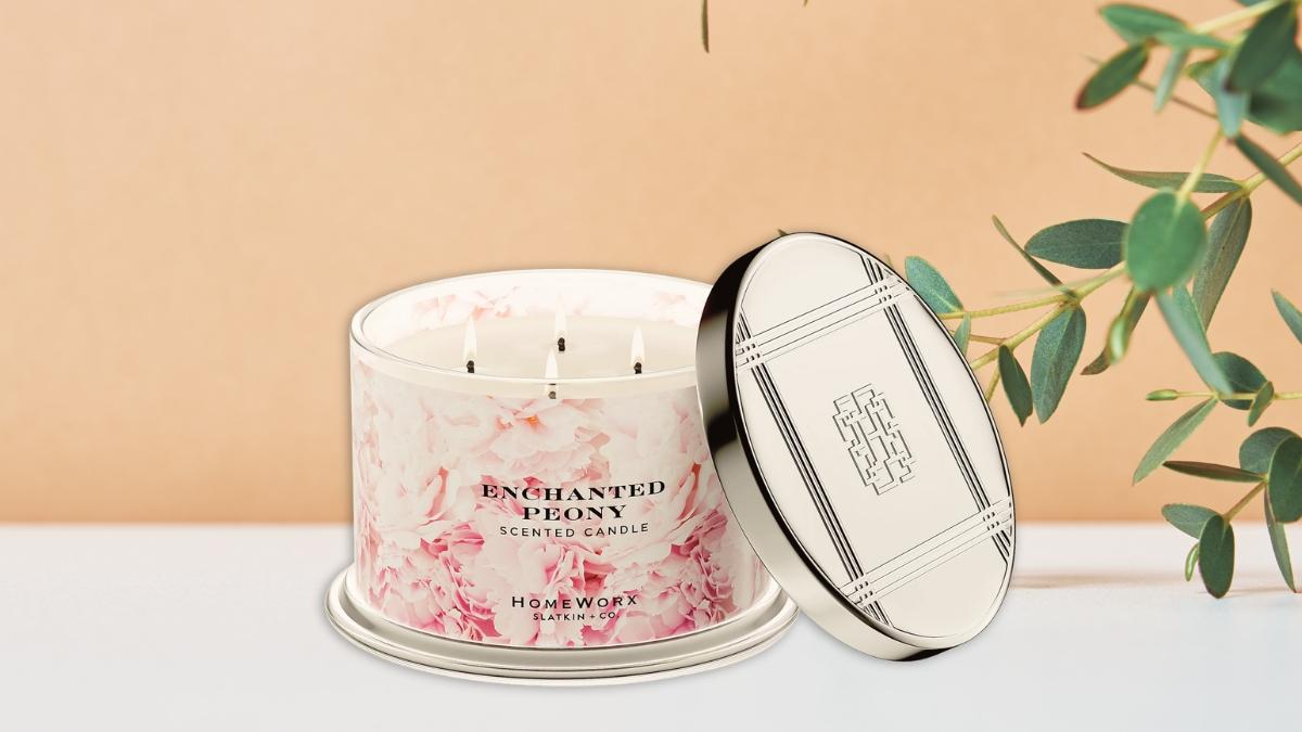 HomeWorx by Slatkin + Co. Enchanted Peony scented jar candle with floral design and silver lid.