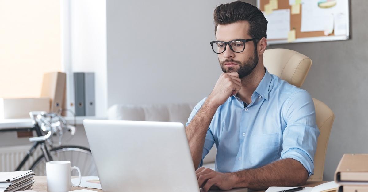Business professional working on laptop while managing DoorDash for Business meal orders